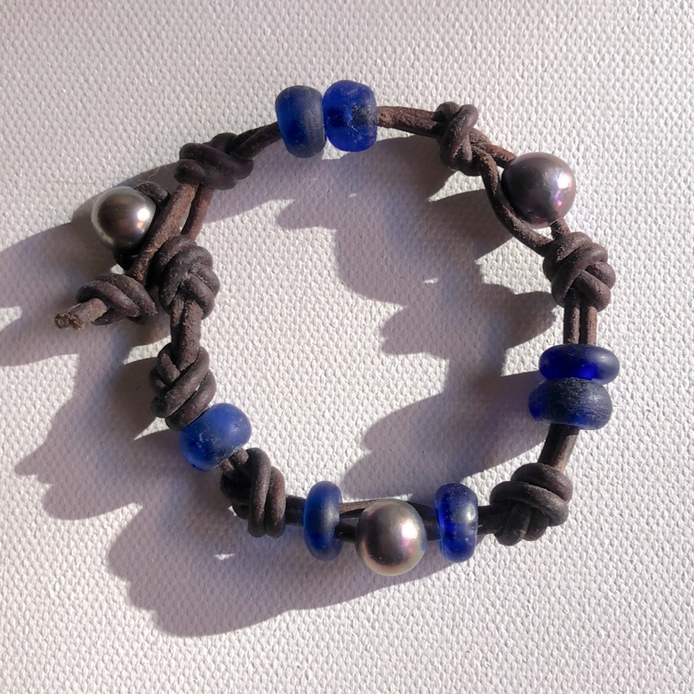 artist made leather knot bracelet with blue and silver beads. NWOT